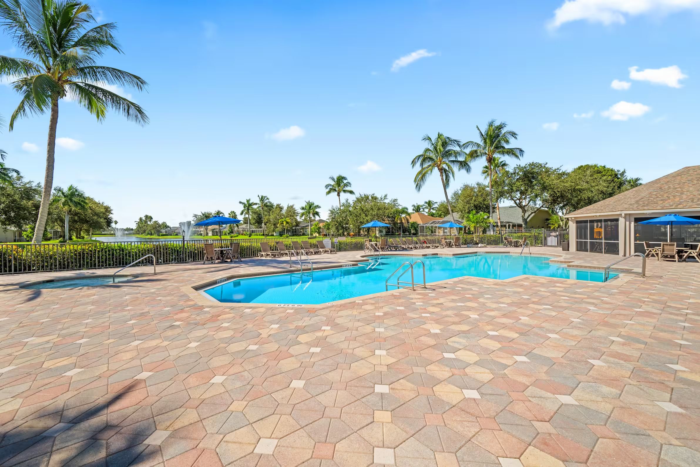 Community pool with a paver deck in Naples